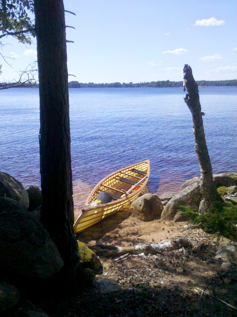 The canoe beached on a swedisch lake shore